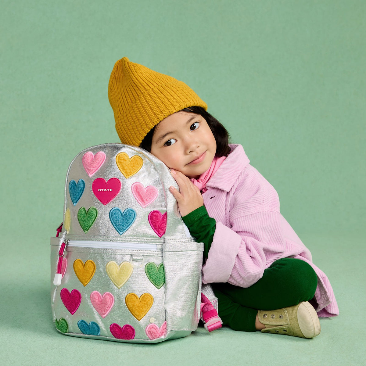 State Bags Kane Mini Backpack Metallic Happy Fuzzy Hearts